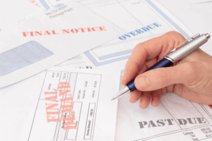Financial documents and past due bills related to checking mortgage credit